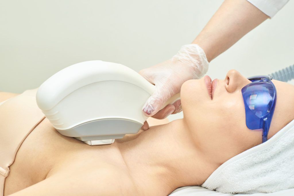 Patient receiving an IPL photofacial treatment at Forte Faces in Conshohocken to address post-summer sun damage, uneven tone, and broken capillaries.